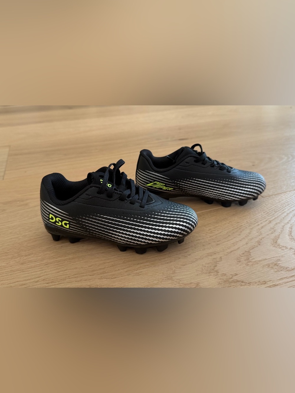 DSG Kids Black Soccer Cleats with Neon Yellow Logo